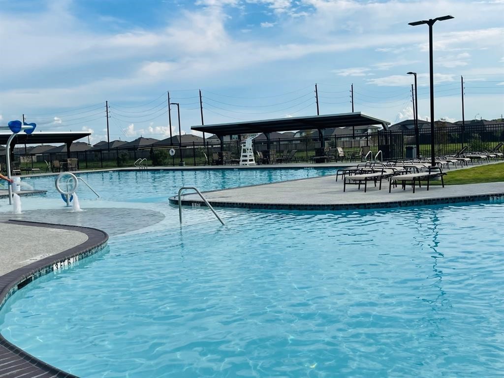7815 Elm Birch Lane Rosharon, TX 77583 - Photo 16 of 19 a view of a swimming pool with outdoor seating