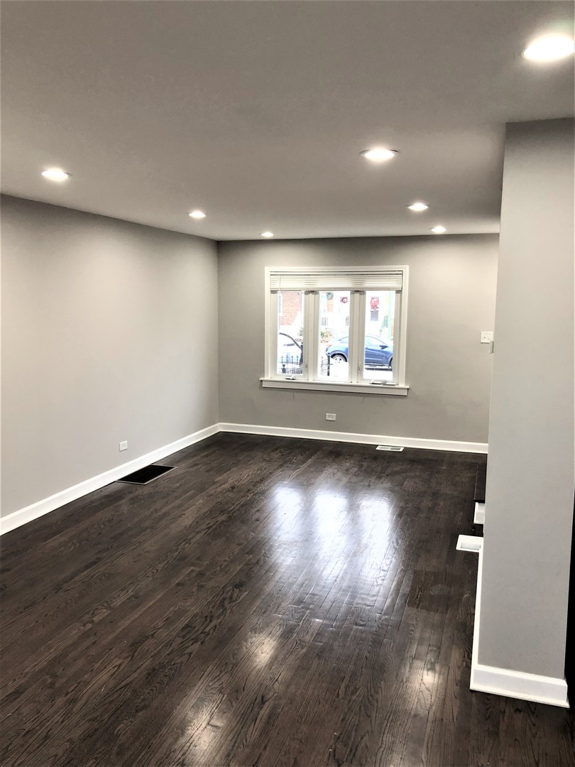6360 Long Avenue Chicago, IL 60638 - Photo 11 of 29 an empty room with wooden floor and windows