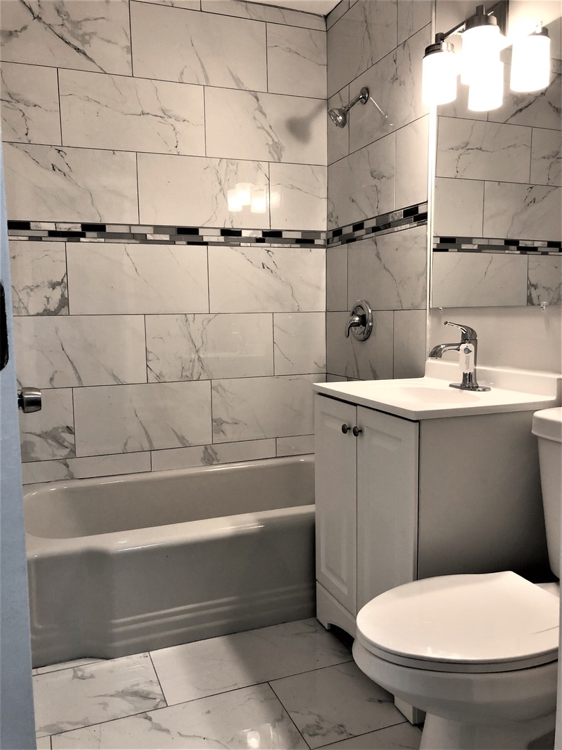 6360 Long Avenue Chicago, IL 60638 - Photo 12 of 29 a bathroom with a sink and toilet