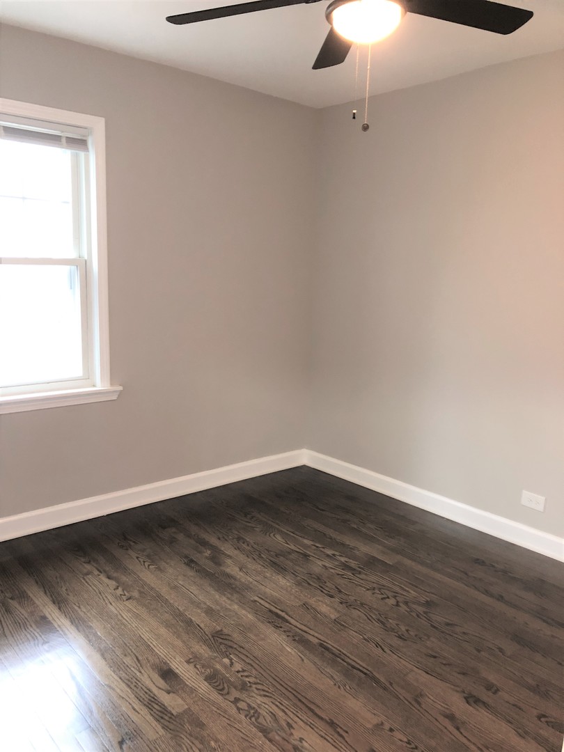 6360 Long Avenue Chicago, IL 60638 - Photo 15 of 29 wooden floor in an empty room with a window