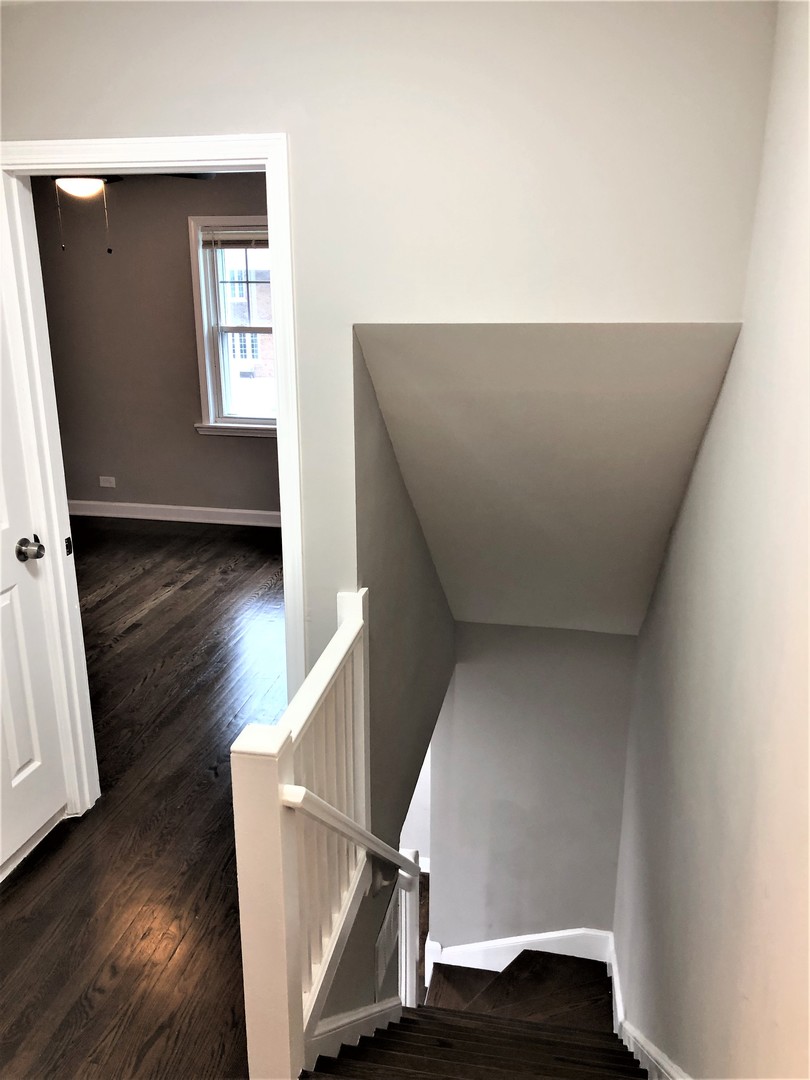 6360 Long Avenue Chicago, IL 60638 - Photo 19 of 29 wooden floor with staircase