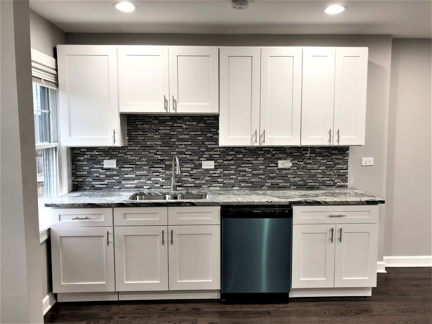 6360 Long Avenue Chicago, IL 60638 - Photo 2 of 29 a kitchen with granite countertop white cabinets and sink