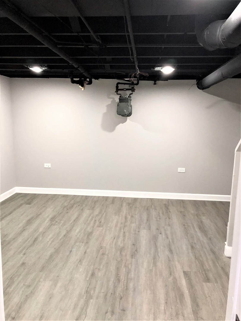 6360 Long Avenue Chicago, IL 60638 - Photo 21 of 29 a view of a room with rack and wooden floor