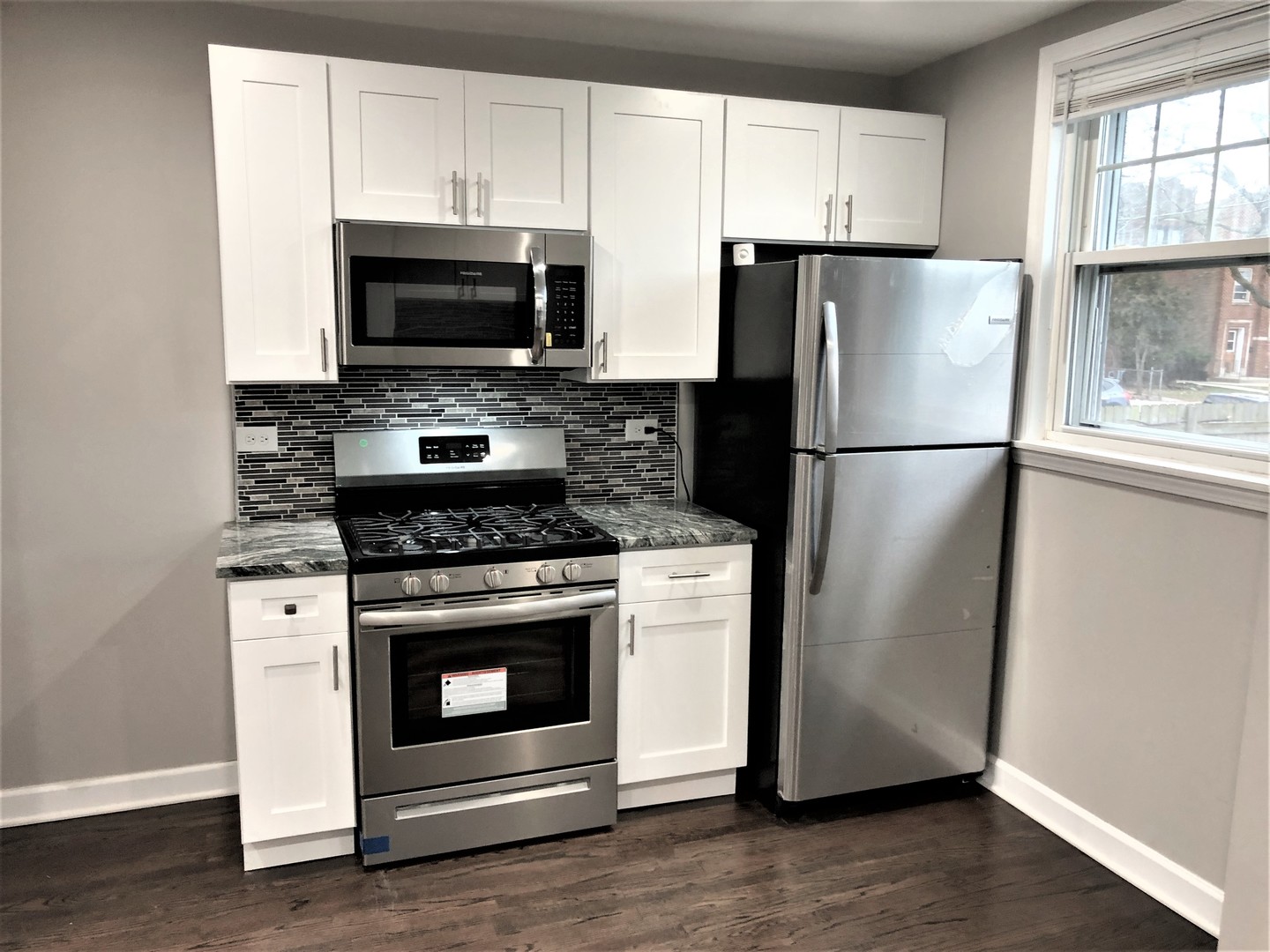 6360 Long Avenue Chicago, IL 60638 - Photo 3 of 29 a kitchen with a stove microwave and refrigerator
