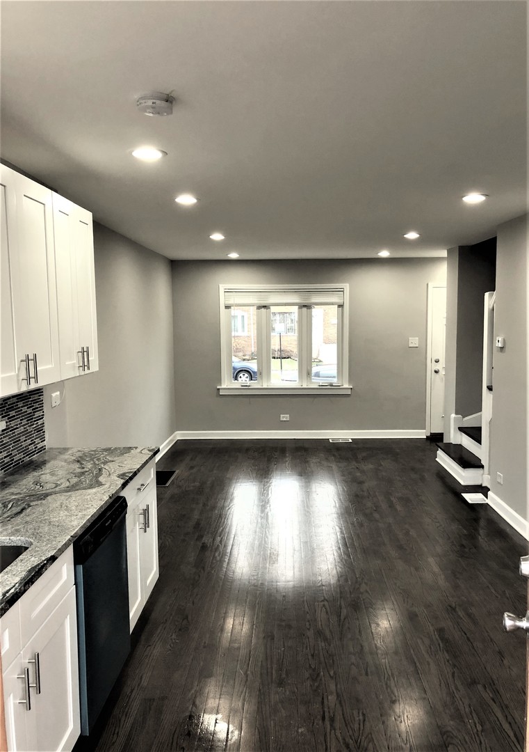 6360 Long Avenue Chicago, IL 60638 - Photo 6 of 29 a view of an empty room with window and wooden floor
