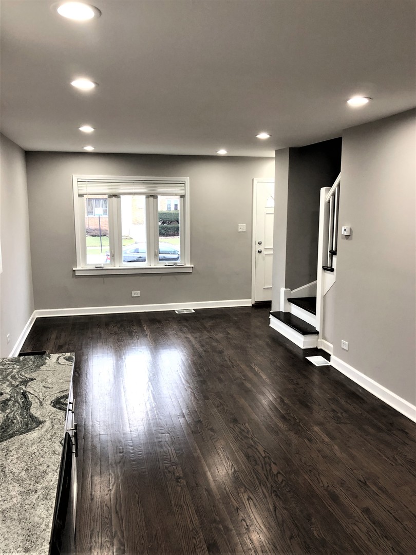 6360 Long Avenue Chicago, IL 60638 - Photo 8 of 29 an empty room with wooden floor and windows