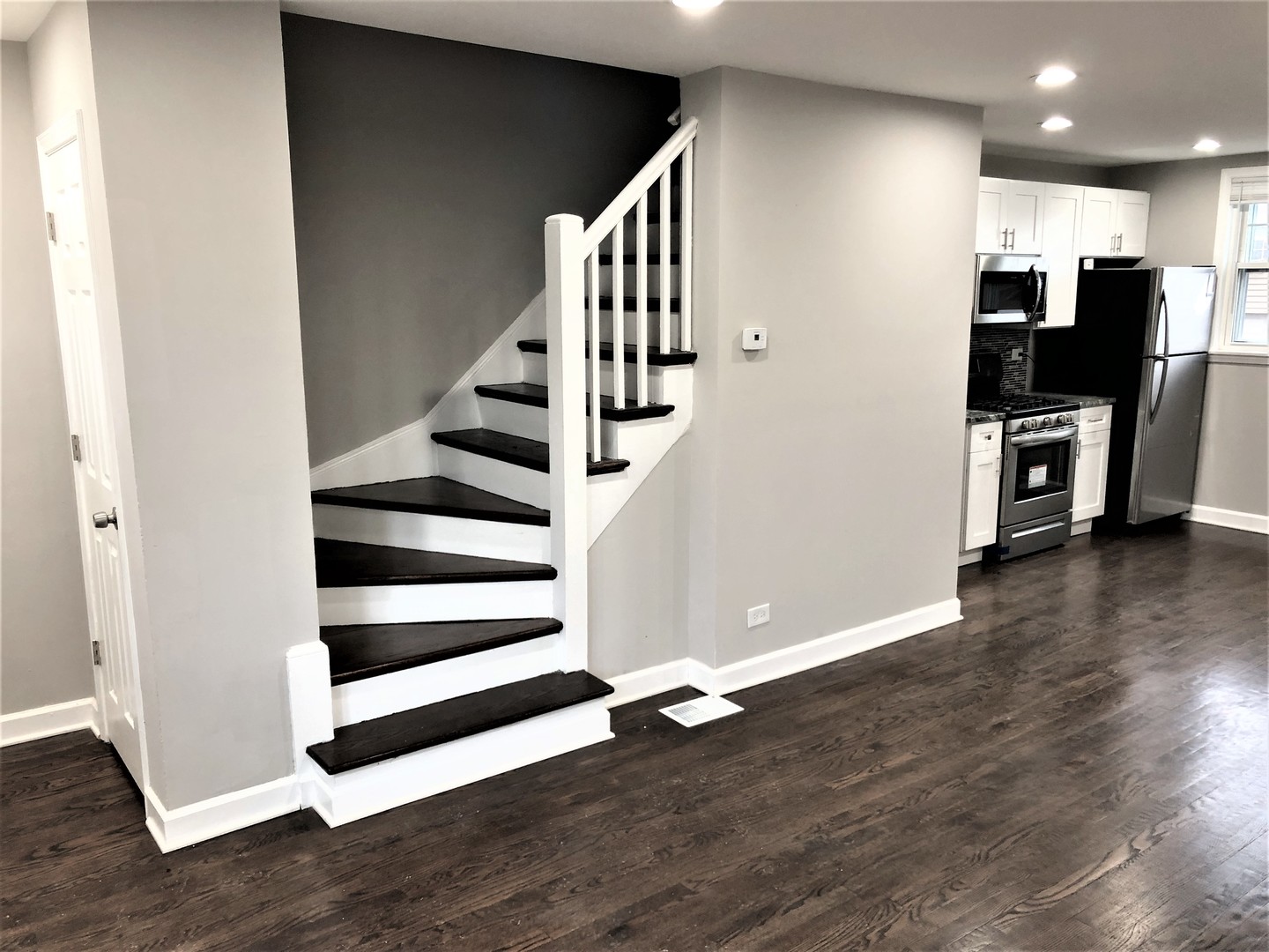 6360 Long Avenue Chicago, IL 60638 - Photo 9 of 29 a view of a kitchen with wooden floor and electronic appliances