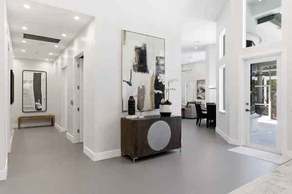 a bathroom with a bathtub sink and mirror