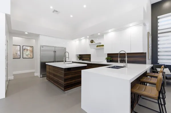 a bedroom with a bed and a wooden floor