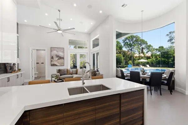a kitchen with stainless steel appliances granite countertop a sink stove and cabinets