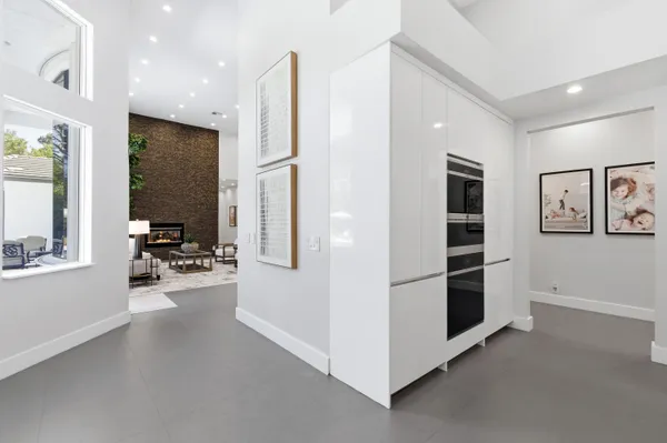 a view of a house with swimming pool and sitting area