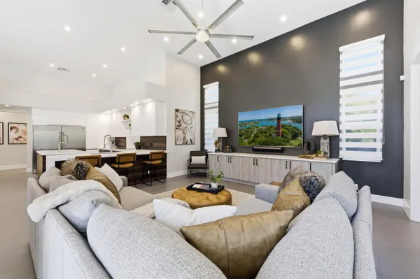 a view of a house with a backyard porch and sitting area