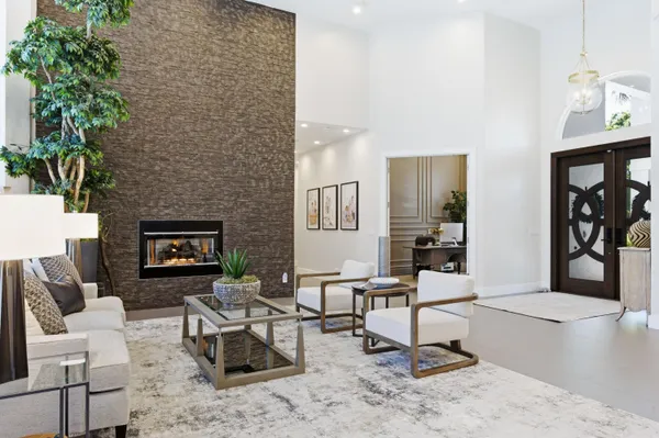 a living room with furniture and a large window