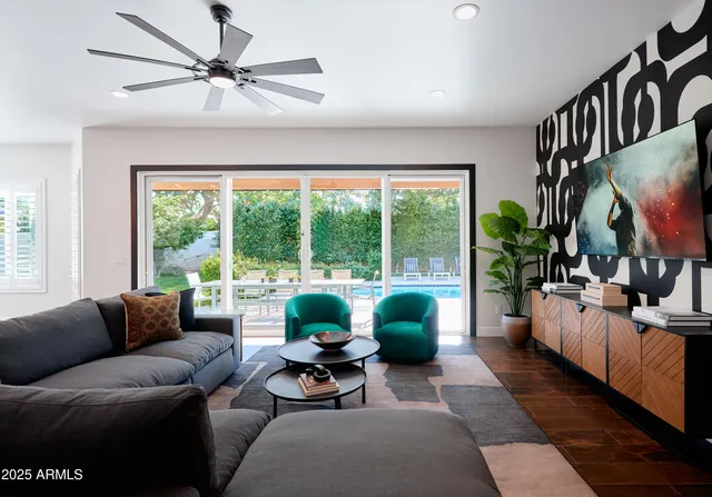 a living room with furniture and a large window