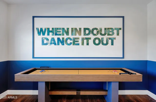 a room with a table and chairs