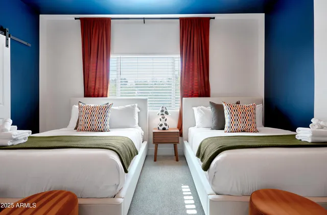 a bedroom with bed and window