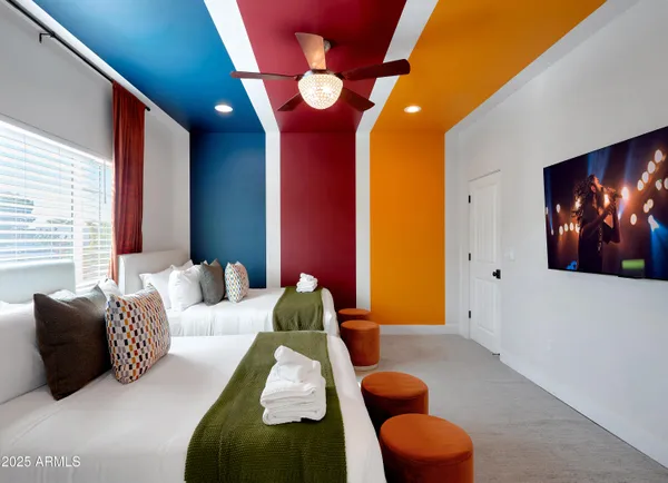 a bedroom with furniture and a lamp