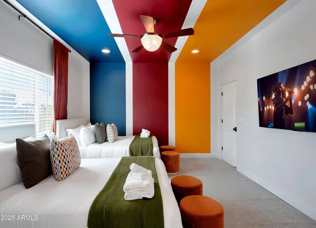 a bedroom with furniture and a lamp