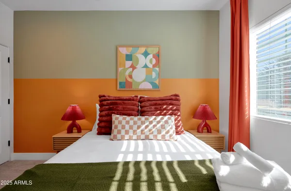 a bedroom with a bed and window