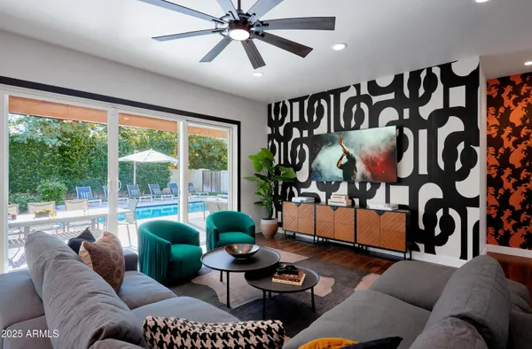 a living room with furniture and a large window