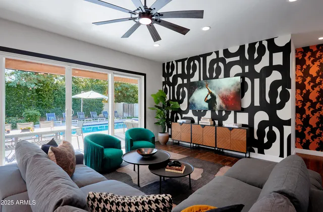 a living room with furniture and a large window