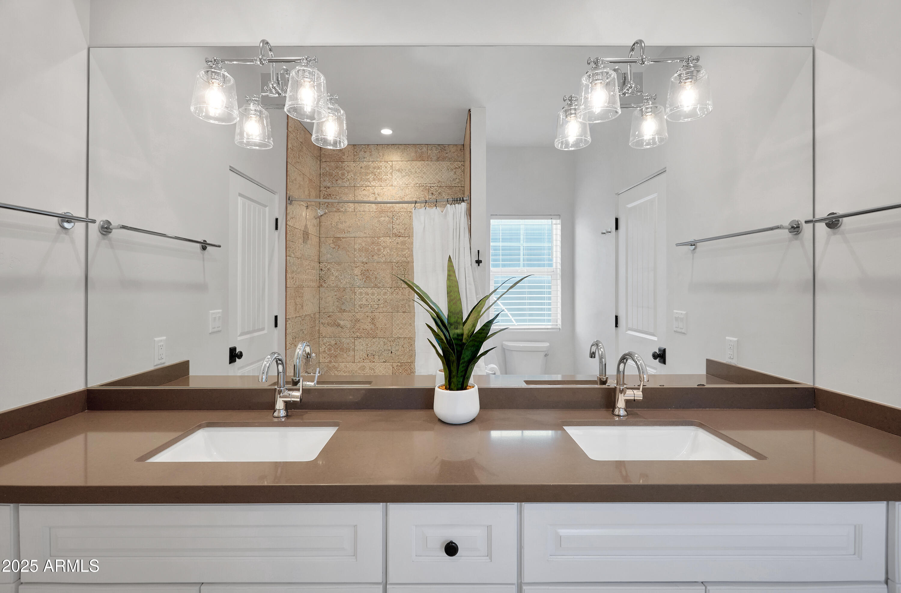 3229 East Campbell Avenue Phoenix, AZ 85018 - Photo 32 of 44 a bathroom with a sink and a mirror