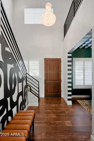 a view of entryway with stairs and wooden floor