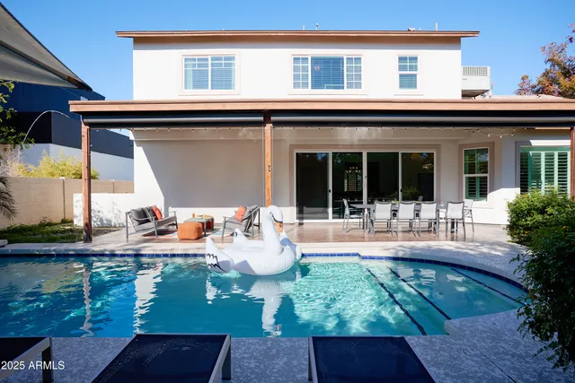 a front view of house with yard outdoor seating and barbeque oven