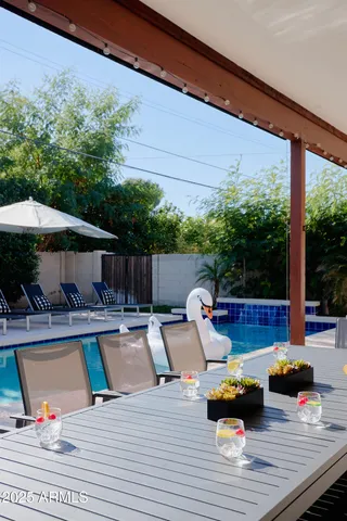 a view of swimming pool with lounge chair