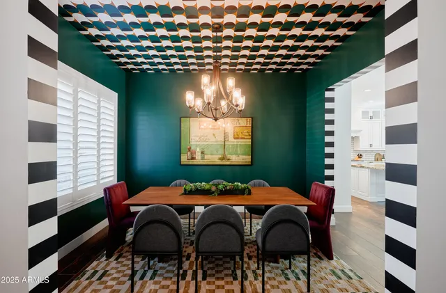 a dining room with furniture and window