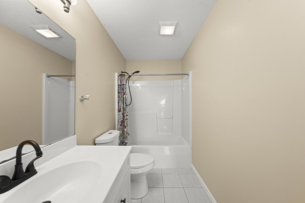 1507 East Mountain Road Westfield, MA 01085 - Photo 22 of 42 a bathroom with a sink a toilet and shower