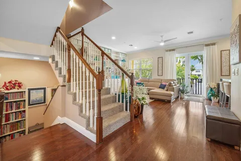 a view of entryway and hall with wooden floor