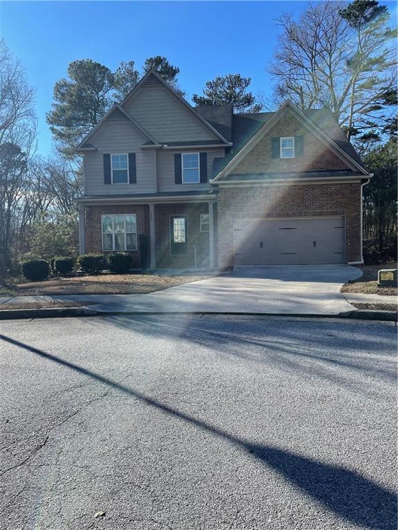 1569 Campbell Ridge Lane Lawrenceville, GA 30045 - Photo 1 of 1 a front view of a house with a yard