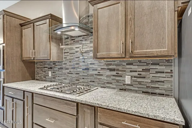 a kitchen with a stove and a cabinet