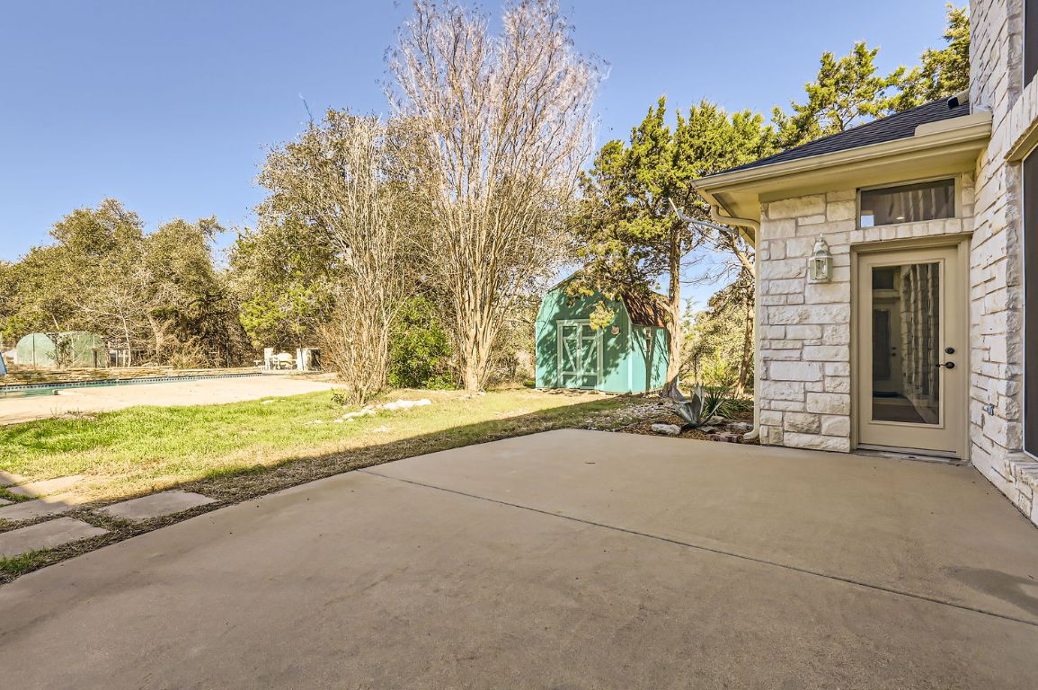 210 Amandas Way Leander, TX 78641 - Photo 4 of 38 View of patio featuring an outdoor structure and a shed