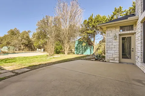a view of a house with a yard and garage
