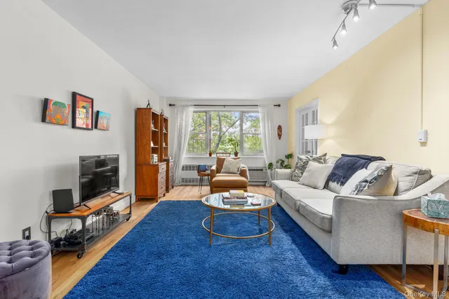 a living room with furniture fireplace and a flat screen tv
