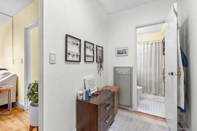 a view of a bedroom with workspace and a window