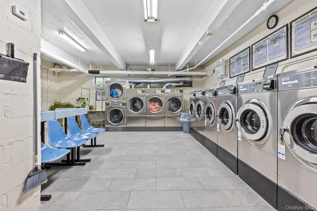 a view of a storage & utility room with washer and dryer