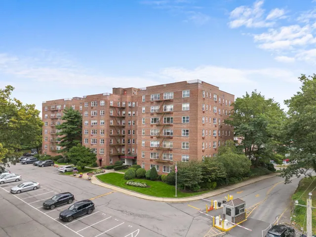 a picture of a bench in front of a gate