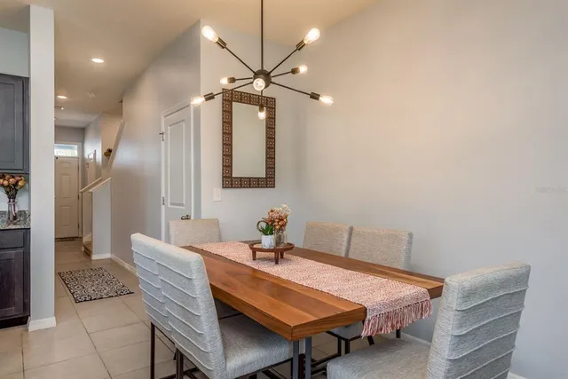 a dining room with a table and chairs