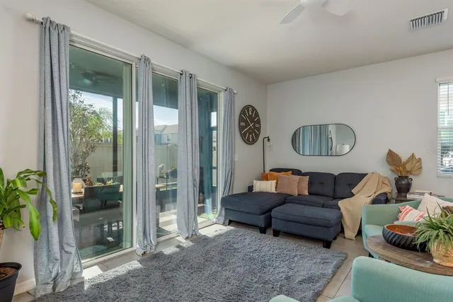 a living room with furniture and a window