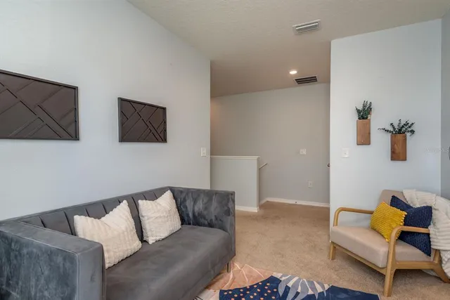 a living room with furniture and a couch