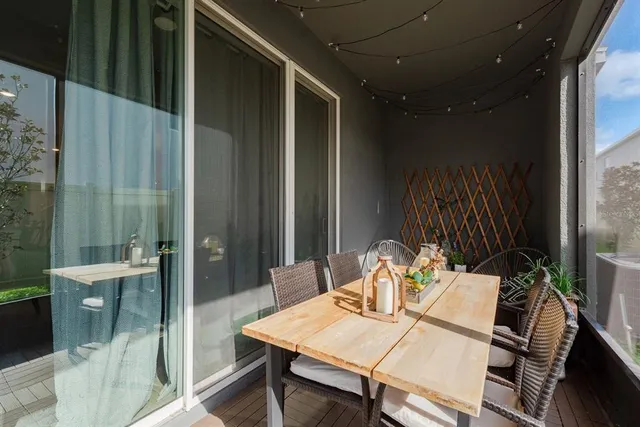 a dining room with furniture and wooden floor