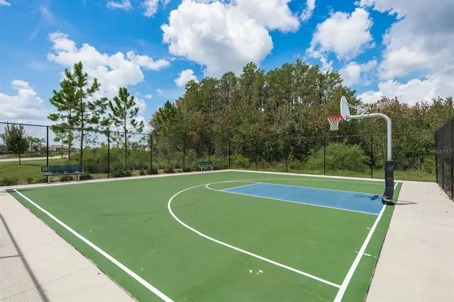 a view of a table and chairs under an umbrella