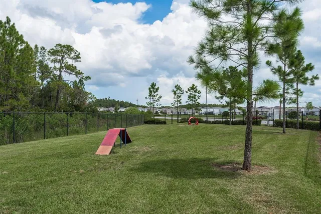 an aerial view of a house with swimming pool garden and mountains