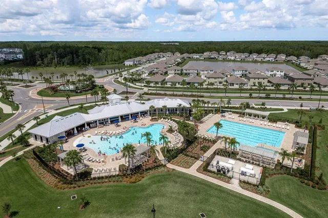 an aerial view of residential houses with outdoor space