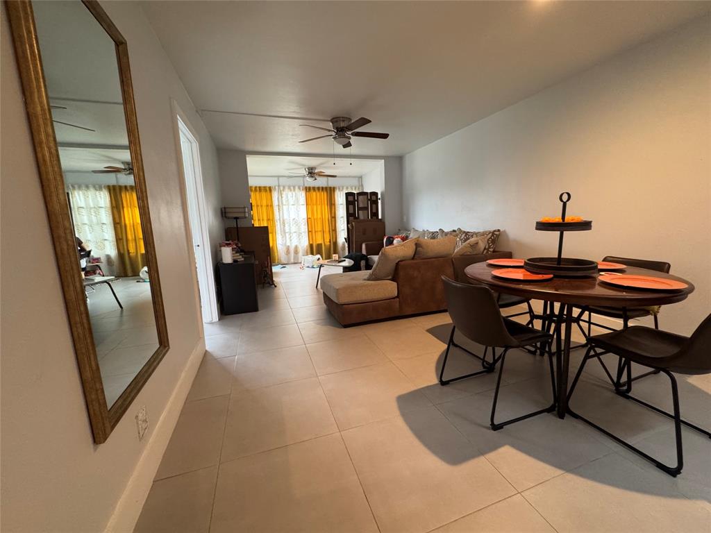 9235 A Lagoon Place, Unit 310 Davie, FL 33324 - Photo 1 of 32 a living room with furniture and a chandelier