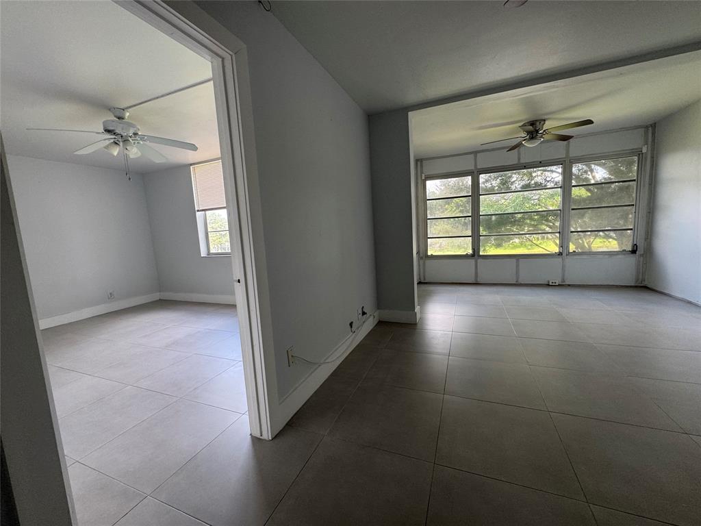 9235 A Lagoon Place, Unit 310 Davie, FL 33324 - Photo 12 of 32 a view of an empty room with a window
