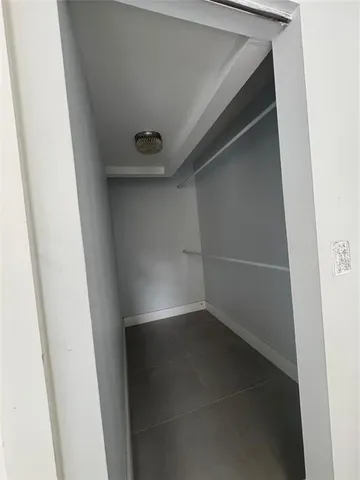 an empty room with a wooden door